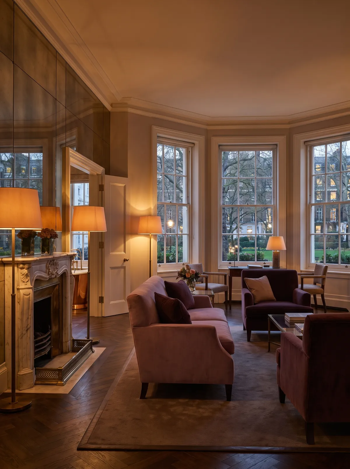 The Ashbridge Suite: velvet sofas around a marble fireplace in a bay of three sash windows over the square